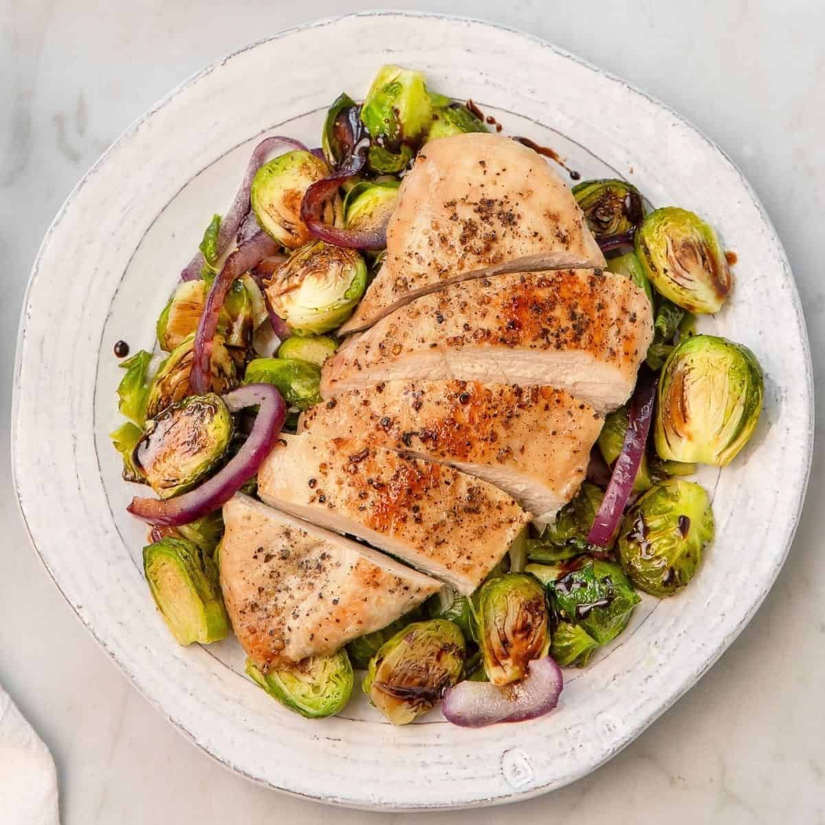 Baked Chicken Breast with a Side of Roasted Brussels Sprouts and Quinoa